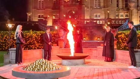 Finalists stand around the fire bowl at the endgame ceremony