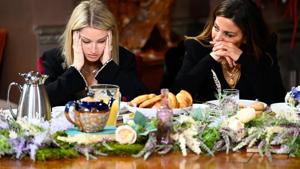 Two Faithful at breakfast, heads in hands, waiting to see who walks in