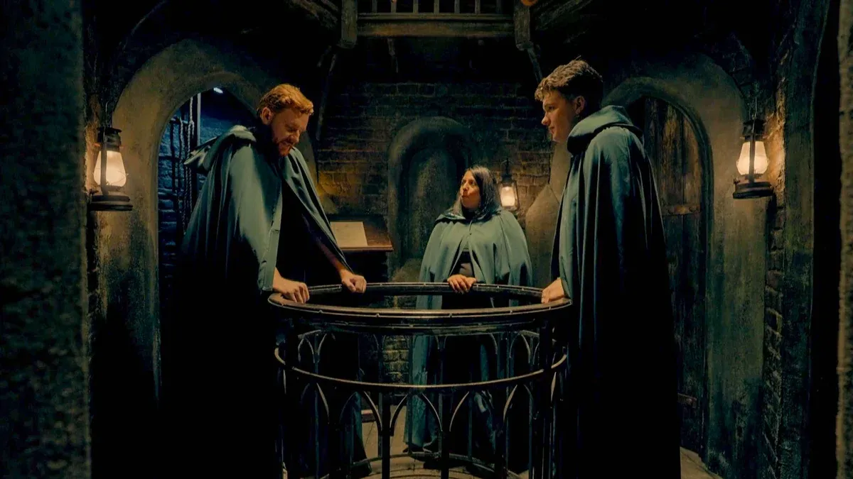 The cloaked Traitors meeting together in the turret